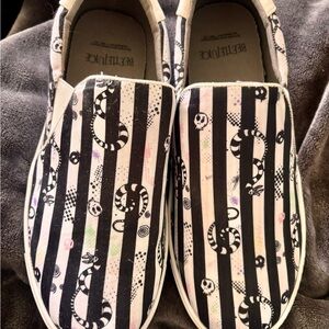 BEETLEJUICE print. Like New Torrid Women’s 9.5WW Striped Slip-On Shoes